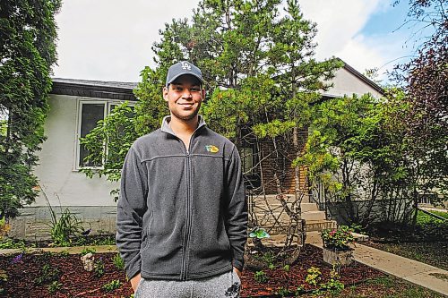 ETHAN CAIRNS / WINNIPEG FREE PRESS

Grayson Nzomwita former RCMP National Youth Advisory Committee member stands outside of his house in Winnipeg, on Wednesday, July 27, 2022. His goal is to become an officer and is currently a student and a Bear Clan Volunteer.