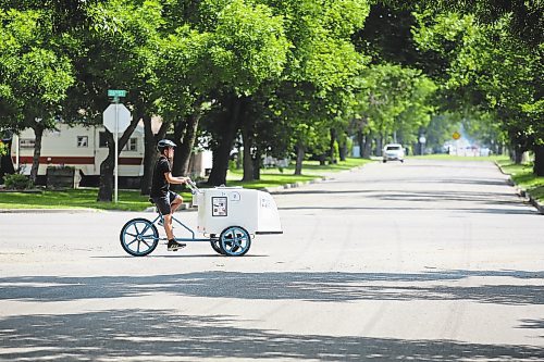 James McDermid rides his ice cream tricycle south on 26th Street selling ice cream on a warm summer afternoon. (Drew May/The Brandon Sun)