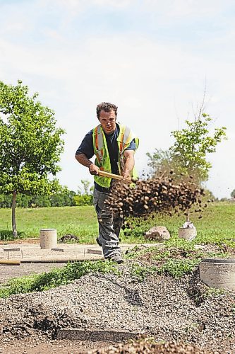Brandon Sun John Duval, groundskeeper with the Riverbank Discovery Centre, digs at the site of the Labyrinth of Peace, which was installed in 2002 by Brandon University. The labyrinth was designed to note the many religions, cultures, and communities that coexist within Brandon and the surrounding area, and the symbols each religion or culture uses to represent itself. The site is in need of renovation, and Duval says he and his parner on the project, Lucas Vasconcelos, hope to complete the work by mid-August. (Matt Goerzen/The Brandon Sun)