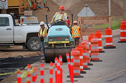 A construction worker at the Daly Overpass operates a roller on the north side of the bridge Monday afternoon. The $65-million project to expand the overpass to four lanes is scheduled to be completed by 2024. (Matt Goerzen/The Brandon Sun)