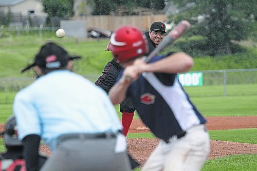 Sioux Valley Dakotas pitcher Randal Wasicana deals against the RFNOW Cardinals during an Andrew Agencies Senior AA Baseball League game at Sumner Field on a rainy Wednesday evening. The game was still in progress at press time. (Thomas Friesen/The Brandon Sun)