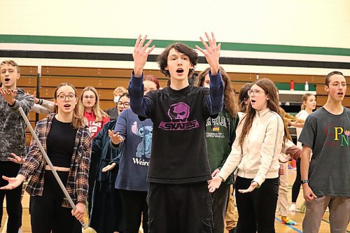 Cohen Jago, middle, performs the song "A Rumor in St. Petersburg" alongside his fellow École secondaire Neelin High School drama students during a rehearsal Friday afternoon. The cast is currently preparing to present their own version of “Anastasia: The Musical” at the Western Manitoba Centennial Auditorium throughout Dec. 1-3. (Kyle Darbyson/The Brandon Sun)