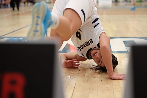 18112022
Chelsea Misskey #6 of the Brandon Bobcats tumbles to the floor after taking a shot on net during university women&#x2019;s basketball action against the University of Lethbridge Pronghorns at the BU Healthy Living Centre on Friday evening. (Tim Smith/The Brandon Sun)