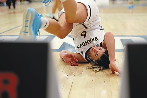 18112022
Chelsea Misskey #6 of the Brandon Bobcats tumbles to the floor after taking a shot on net during university women&#x2019;s basketball action against the University of Lethbridge Pronghorns at the BU Healthy Living Centre on Friday evening. (Tim Smith/The Brandon Sun)