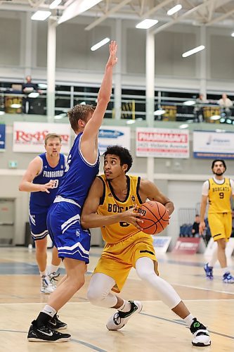 Dominique Dennis #6 of the Brandon Bobcats tries to slip around Tag Layton #6 of the University of Lethbridge Pronghorns during university men’s basketball action at the BU Healthy Living Centre on Friday evening. (Tim Smith/The Brandon Sun)