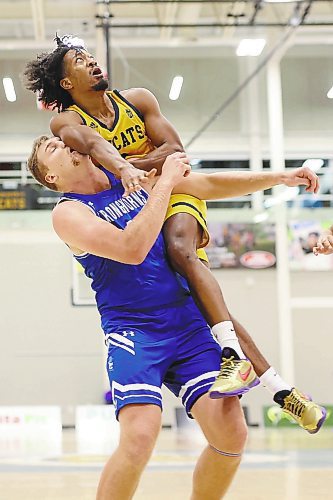 18112022
Jahmaal Gardner #2 of the Brandon Bobcats comes down on top of Jeff Rodehutskors #40 of the University of Lethbridge Pronghorns after taking a shot during university men&#x2019;s basketball action at the BU Healthy Living Centre on Friday evening. (Tim Smith/The Brandon Sun)