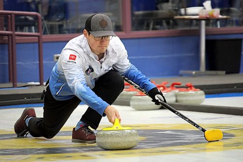 Ethan Sampson delivers a rock during the men's event final at the Sun Life Financial Junior Challenge at the Brandon Curling Club on Sunday. (Lucas Punkari/The Brandon Sun)