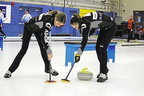 Second Mikaylah Lyburn, left, and lead Makenna Hadway of Katy Lukowich's rink from the Fort Garry Curling Club in Winnipeg sweep a rock that was thrown by third Lauren Rajala during the women's event final of the Sun Life Financial Junior Challenge at the Brandon Curling Club on Sunday afternoon. (Lucas Punkari/The Brandon Sun)