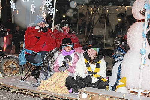 Members of the Poplar Hill 4-H Club smile for the camera during Saturday's Brandon Santa Parade. (Kyle Darbyson/The Brandon Sun)