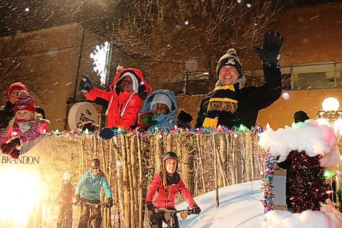 Newly-minted Brandon mayor Jeff Fawcett waves to the crowd during Saturday's Santa Parade, which took place throughout the city's downtown core. This is Fawcett's first Brandon Santa Parade as mayor. He was officially elected late last month. (Kyle Darbyson/The Brandon Sun)