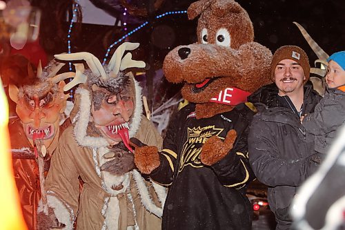 Brandon Wheat Kings mascot Willie poses for a photo with some Krampus demons during Saturday's Santa Parade, which took place throughout the city's downtown core. (Kyle Darbyson/The Brandon Sun)