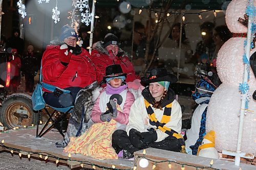 Members of the Poplar Hill 4-H Club smile for the camera during Saturday's Brandon Santa Parade. (Kyle Darbyson/The Brandon Sun)