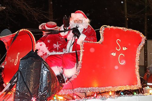 Santa and Mrs. Claus ride down Rosser Avenue during the 2022 Brandon Santa Parade, which took place on Saturday evening. This year's parade marked a grand return for the holiday-themed event, which has been on hiatus since 2020 due to the COVID-19 pandemic. See more photos on Page A3. (Kyle Darbyson/The Brandon Sun)  