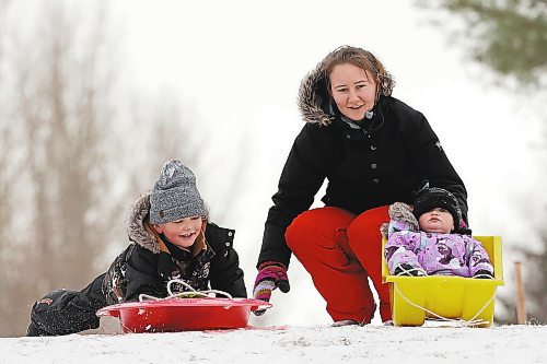21112022
Siblings Liam and Reagen Waldner toboggan with their mom Joyce at the sugar bowl on 34th Street on a mild Monday. 
(Tim Smith/The Brandon Sun)