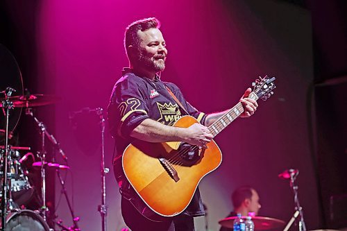 Guitarist Dave Wasyliw wears a Brandon Wheat Kings jersey alongside other members of the band during Doc Walker’s set at Westoba Place Tuesday evening. (Tim Smith/The Brandon Sun)