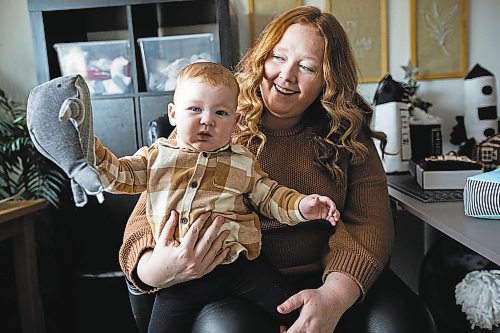 Daniel Crump / Winnipeg Free Press. Ashley Wright (right) co-owner of Emerson&#x573; Playroom, holds her seven-month-old son, Emerson Wright. Emerson is the inspiration behind the brand of children&#x573; toys. November 26, 2022.