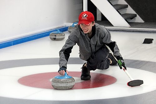 Chris Jones flashes a smile during a Special Olympics curling game at the Riverview Curling Club. (Lucas Punkari/The Brandon Sun)