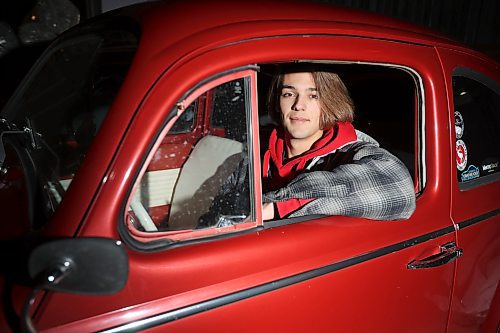 Nick Finley sits inside his 1963 Volkswagen Beetle. The 21-year-old says he had wanted a Beetle since he was 11 years old after he first saw the 1968 movie, “The Love Bug.” (Tim Smith/The Brandon Sun)