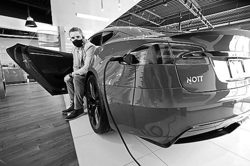 RUTH BONNEVILLE / WINNIPEG FREE PRESS



Biz - Tesla sales 



Portrait of Trevor Nott, owner of Nott Autocorp, next to a Tesla -  2021, model S Plaid edition, in his showroom.



Nott has seen a huge spike in people buying Teslas, especially as the price of gas increases.



Story - Gabby Pich&#xe9;



March 8th,  2022
