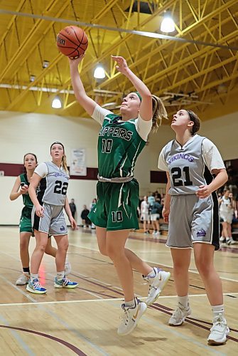 Ava Paziuk of the Dauphin Clippers shoots against the Vincent Massey Vikings in the Crocus Plains Early Bird varsity girls basketball tournament on Friday. (Tim Smith/The Brandon Sun)