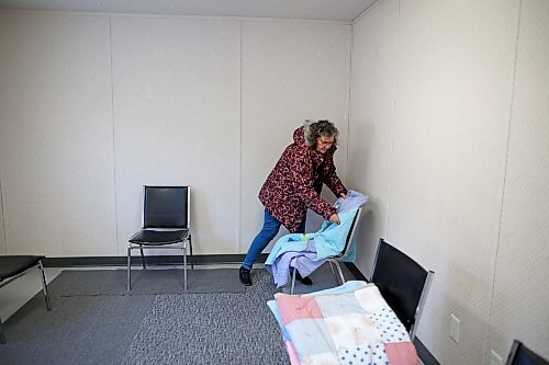 Barbara McNish, executive director of Samaritan House Ministries, puts out blankets for use in The Q, the new warming trailer meant to house additional under-resourced Brandonites overnight when the Samaritan House safe and warm shelter is over capacity. (Tim Smith/The Brandon Sun)