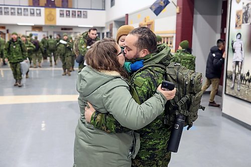 08122022
Cpl Michael Lesperance kisses his wife Nicole and hugs his son Maverick, three, after arriving back to CFB Shilo from Latvia late Thursday night along with fellow troops from 2PPCLI and the 1st Regiment, Royal Canadian Horse Artillery following a six month deployment as part of Operation Reassurance. Over 500 troops have been returning home from Shilo over the past few weeks with approximately 120 arriving home Thursday. Other troops from Shilo deployed to Latvia in recent days as part of the ongoing operation. 
(Tim Smith/The Brandon Sun)