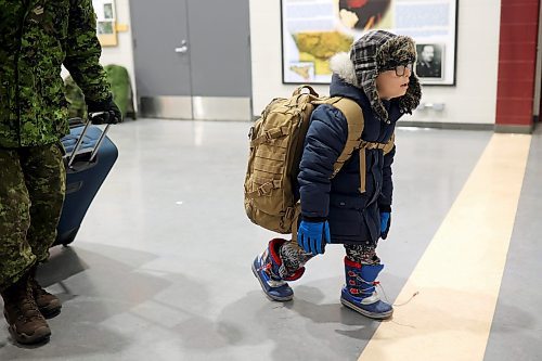 08122022
Six-year-old Hudson Sparks carries his dad's backpack after MCpl Rory Sparks with 2nd Battalion, Princess Patricia's Canadian Light Infantry, arrived back to CFB Shilo from Latvia late Thursday night along with fellow troops from 2PPCLI and the 1st Regiment, Royal Canadian Horse Artillery after a six month deployment as part of Operation Reassurance. Over 500 troops have been returning home from Shilo over the past few weeks with approximately 120 arriving home Thursday. Other troops from Shilo deployed to Latvia in recent days as part of the ongoing operation. 
(Tim Smith/The Brandon Sun)