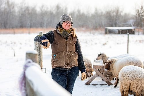 MIKAELA MACKENZIE / WINNIPEG FREE PRESS

Anna Hunter, co-director of Pembina Fibreshed, poses for a portrait with her flock of wool sheep at her fibre farm east of Winnipeg on Tuesday, Dec. 6, 2022. For green page story.
Winnipeg Free Press 2022.