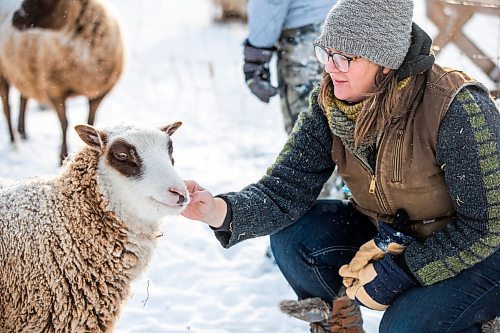 MIKAELA MACKENZIE / WINNIPEG FREE PRESS

Anna Hunter, co-director of Pembina Fibreshed, poses for a portrait with her flock of wool sheep at her fibre farm east of Winnipeg on Tuesday, Dec. 6, 2022. For green page story.
Winnipeg Free Press 2022.