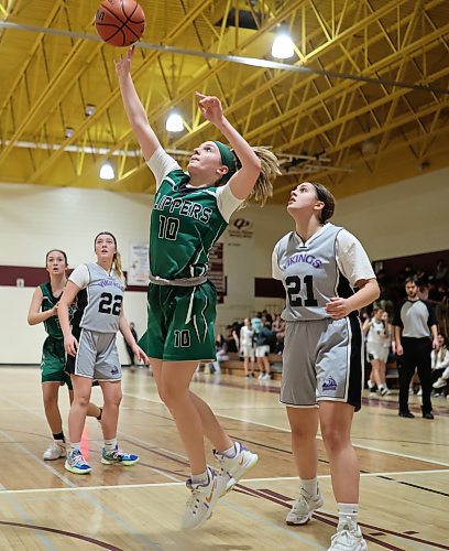09122022
Ava Paziuk #10 of the Dauphin Clippers leaps for a shot on net during the Clippers match against the Vincent Massey Vikings in the Crocus Plains Early Bird varsity girls basketball tournament at Crocus Plains Regional Secondary School on Friday. (Tim Smith/The Brandon Sun)