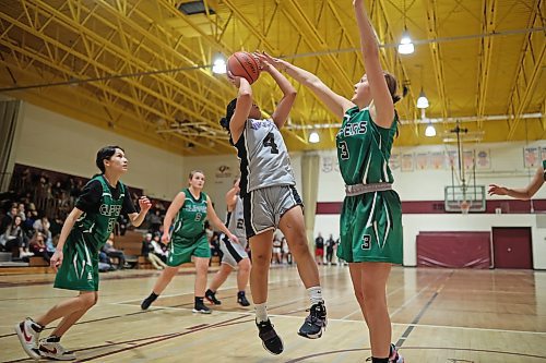 09122022
Althea Gonowon #4 of the Vincent Massey Vikings tries to get a shot past Kristen Genik #3 of the Dauphin Clippers during their Crocus Plains Early Bird varsity girls basketball tournament match at Crocus Plains Regional Secondary School on Friday. (Tim Smith/The Brandon Sun)
