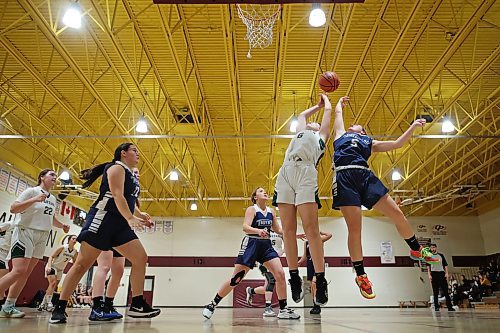 09122022
Claire Foerester #6 of the Neelin Spartans and Crystal Zamzow of the Swan River Tigers leap for the loose ball during their Crocus Plains Early Bird varsity girls basketball tournament at Crocus Plains Regional Secondary School on Friday. (Tim Smith/The Brandon Sun)