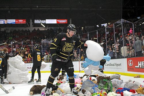 Brett Hyland picks out his favourite stuffed animal (Smurf) after Nate Danielson scored the teddy bear toss-goal during the Brandon Wheat Kings 2-1 victory over the Spokane Chiefs in Western Hockey League action at Westoba Place on Saturday. (Thomas Friesen/The Brandon Sun)