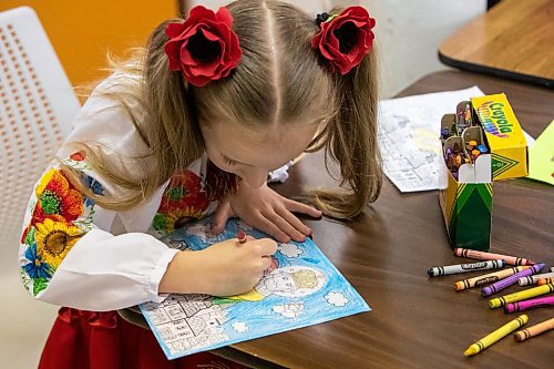 Daniel Crump / Winnipeg Free Press. Polina Zhuchenko, 7, colours a scene featuring St. Mykolai at a Christmas event for recently arrived Ukrainian kids at Oseredok Ukrainian Cultural and Educational Centre. December 10, 2022.