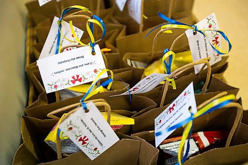 Daniel Crump / Winnipeg Free Press. Gift bags wait to be handed out at a Christmas event for recently arrived Ukrainian kids at Oseredok Ukrainian Cultural and Educational Centre. The tag reads &#x483;hildren who love St. Mykolai&#x260;greetings from Oseredok.&#x4e0;December 10, 2022.
