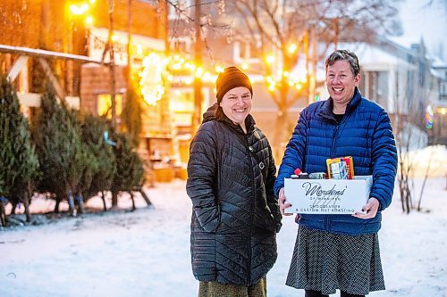 MIKAELA MACKENZIE / WINNIPEG FREE PRESS

Mel Bowman Wilson (left) and Grace Sheppard, co-organizers for the third Wolseley hamper program, pose for a photo in Winnipeg on Friday, Dec. 9, 2022. For Malak Abas story.
Winnipeg Free Press 2022.