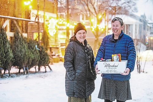 MIKAELA MACKENZIE / WINNIPEG FREE PRESS

Mel Bowman Wilson (left) and Grace Sheppard, co-organizers for the third Wolseley hamper program, pose for a photo in Winnipeg on Friday, Dec. 9, 2022. For Malak Abas story.
Winnipeg Free Press 2022.