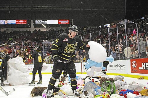 Brett Hyland picks out his favourite stuffed animal (Smurf) after Nate Danielson scored the teddy bear toss-goal during the Brandon Wheat Kings 2-1 victory over the Spokane Chiefs in Western Hockey League action at Westoba Place on Saturday. (Thomas Friesen/The Brandon Sun)