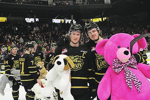 Nate Danielson, centre, scored the teddy bear-toss goal with an assist from Jake Chiasson, right, in the Brandon Wheat Kings 2-1 victory over the Spokane Chiefs in Western Hockey League action at Westoba Place on Saturday. (Thomas Friesen/The Brandon Sun)