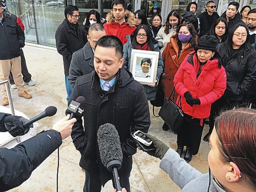 Dean Pritchard / Winnipeg Free Press
Edward Balaquit (left) along with family and friends outside the Law Courts Monday, after Kyle Pietz was given a 16-year prison sentence after being found guilty of manslaughter for Eduardo Balaquit.
