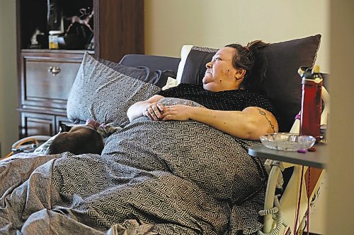 RUTH BONNEVILLE / WINNIPEG FREE PRESS 

local - home care 

Leona Stahl lies in her bed set up in the living room.  She has been bedridden since mid-September.  See Story. 

Leona Stahl needs two home care workers to  help her get out of bed.  She hasn't received that since getting home from hospital on Sept 15 - as a result she has been bedridden since then. It takes two home care people to operate the lift to get her out of bed but only one home care person comes - and even that is not all the time



Dec 12th,  2022