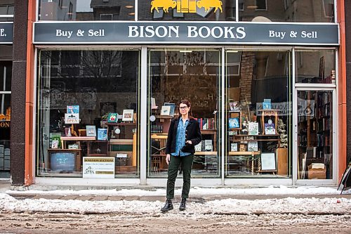 MIKAELA MACKENZIE / WINNIPEG FREE PRESS

Aimee Peake, owner of Bison Books, poses for a portrait in front of her shop in Winnipeg on Monday, Dec. 12, 2022. She&#x2019;s signed a lease for another three years at the Graham Avenue location. For Gabby story.
Winnipeg Free Press 2022.