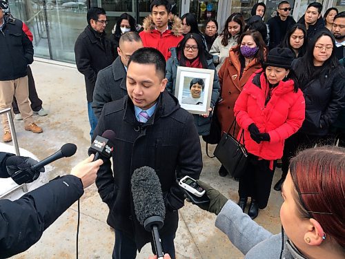 Dean Pritchard / Winnipeg Free Press
Edward Balaquit (left) along with family and friends outside the Law Courts after Kyle Pietz was given a 16-year prison sentence after being found guilty of manslaughter for Eduardo Balaquit.
