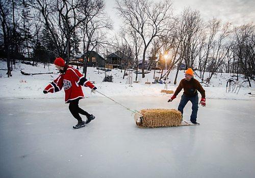 JOHN WOODS / WINNIPEG FREE PRESS
Eric Reder and his son North, 14, get their skating rinks on the Seine River ready for the winter season Monday, December 12, 2022. The pair is having a get together for North&#x2019;s hockey team later this week.

Re: rachel