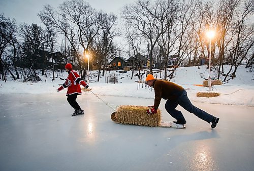 JOHN WOODS / WINNIPEG FREE PRESS
Eric Reder and his son North, 14, get their skating rinks on the Seine River ready for the winter season Monday, December 12, 2022. The pair is having a get together for North&#x2019;s hockey team later this week.

Re: rachel