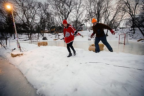 JOHN WOODS / WINNIPEG FREE PRESS
Eric Reder and his son North, 14, get their skating rinks on the Seine River ready for the winter season Monday, December 12, 2022. The pair is having a get together for North&#x2019;s hockey team later this week.

Re: rachel