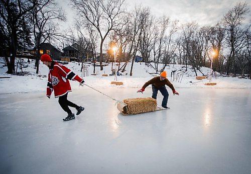 JOHN WOODS / WINNIPEG FREE PRESS
Eric Reder and his son North, 14, get their skating rinks on the Seine River ready for the winter season Monday, December 12, 2022. The pair is having a get together for North&#x2019;s hockey team later this week.

Re: rachel