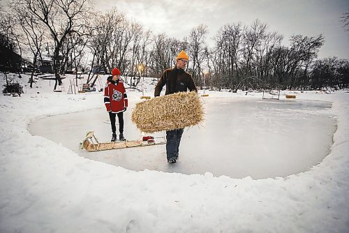 JOHN WOODS / WINNIPEG FREE PRESS
Eric Reder and his son North, 14, get their skating rinks on the Seine River ready for the winter season Monday, December 12, 2022. The pair is having a get together for North&#x2019;s hockey team later this week.

Re: rachel