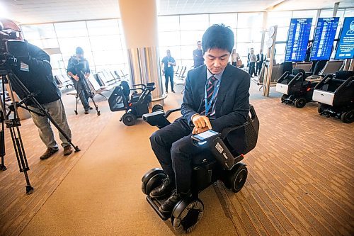 MIKAELA MACKENZIE / WINNIPEG FREE PRESS
Yuta Okumura, director of autonomous program implementation at Scootaround/WHILL demonstrates the new self-driving wheelchairs at Winnipeg James Armstrong Richardson International Airport in Winnipeg Tuesday.