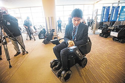 MIKAELA MACKENZIE / WINNIPEG FREE PRESS

Yuta Okumura, director of autonomous program implementation at Scootaround / WHILL demonstrates the new self-driving wheelchairs (the first of their kind in North America) at the Winnipeg James Armstrong Richardson International Airport in Winnipeg on Tuesday, Dec. 13, 2022. For Marty Cash story.
Winnipeg Free Press 2022.